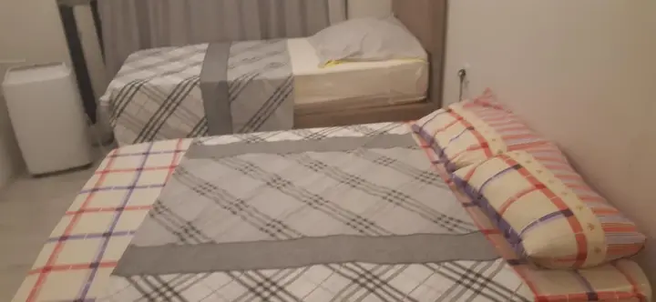 Bedroom with a double bed and a single bed